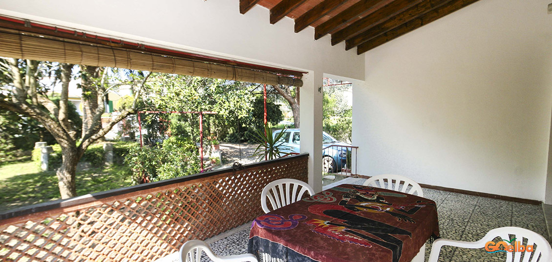 Annarita apartments Marina di Campo veranda with table and chairs